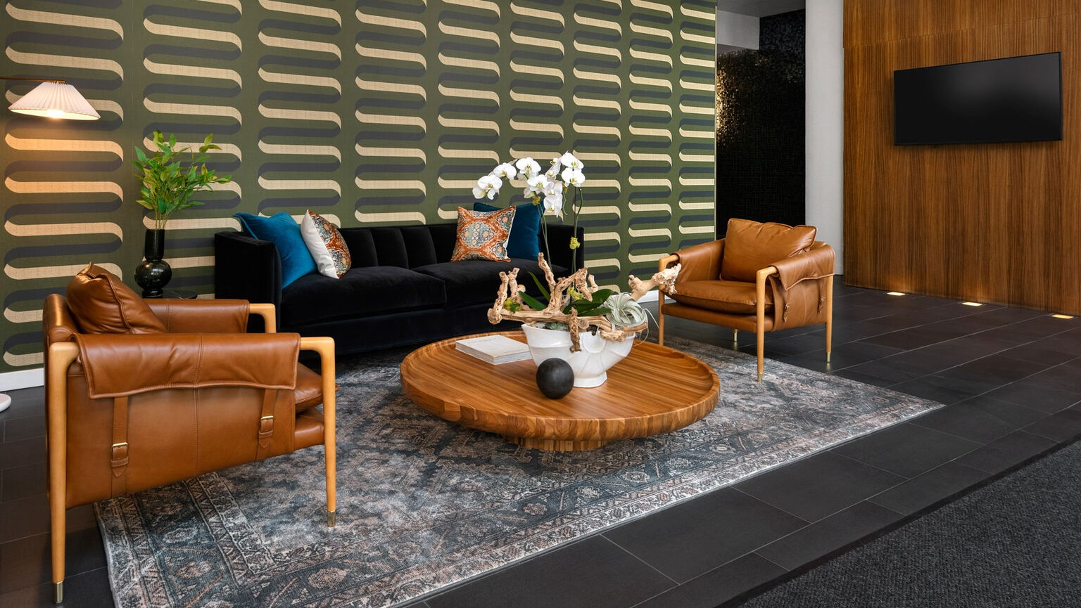 Env Chicago elegant lobby lounge area with stylish seating, modern decor, and sophisticated lighting for residents