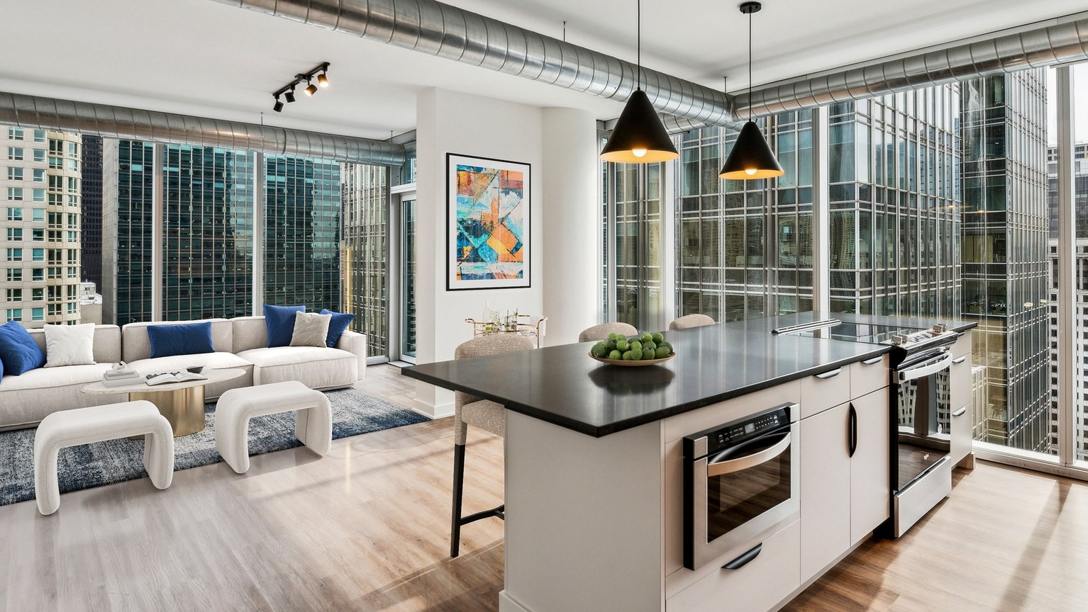Env Chicago luxury kitchen with a large island, premium appliances, and floor-to-ceiling windows overlooking the city