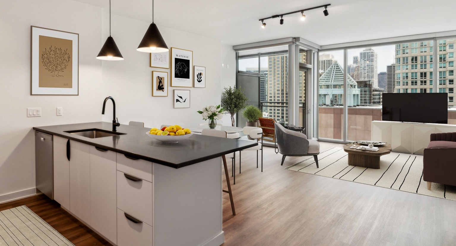 Modern kitchen and dining area in an Env Chicago apartment, with sleek appliances and city views from large windows