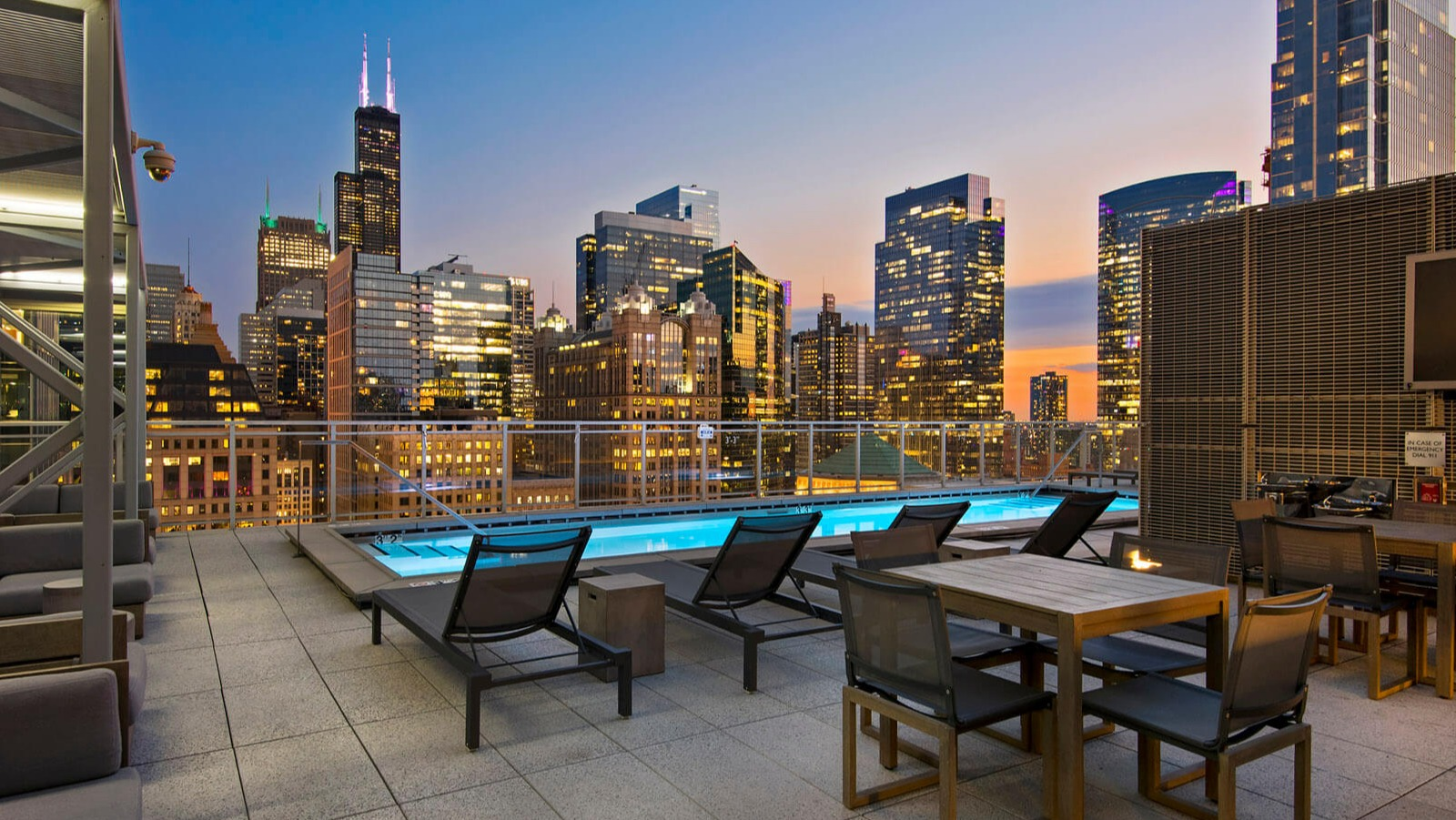 Env Chicago rooftop lounge area with city skyline views, comfortable seating, and an inviting atmosphere at dusk