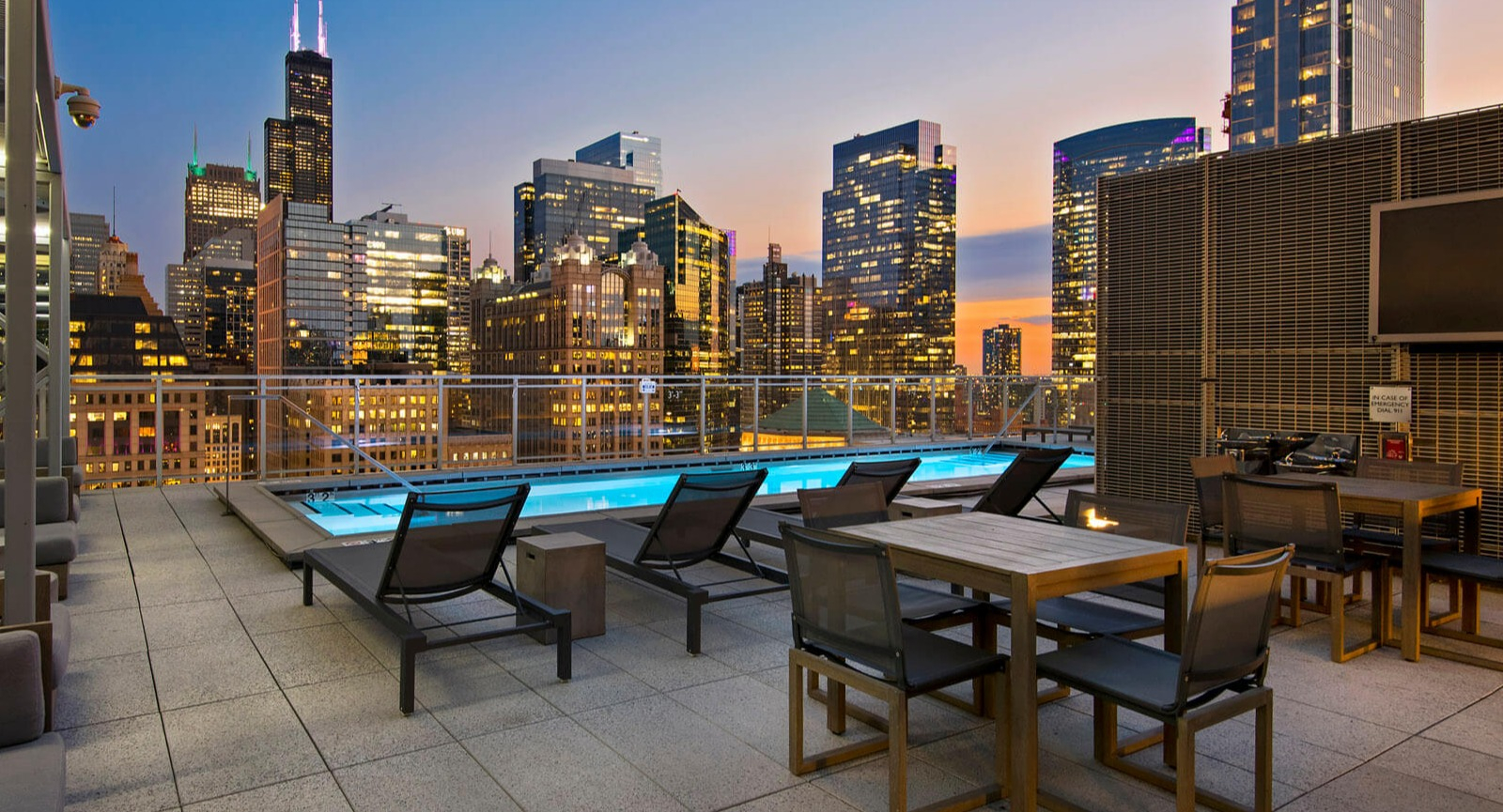 Env Chicago rooftop lounge area with city skyline views, comfortable seating, and an inviting atmosphere at dusk