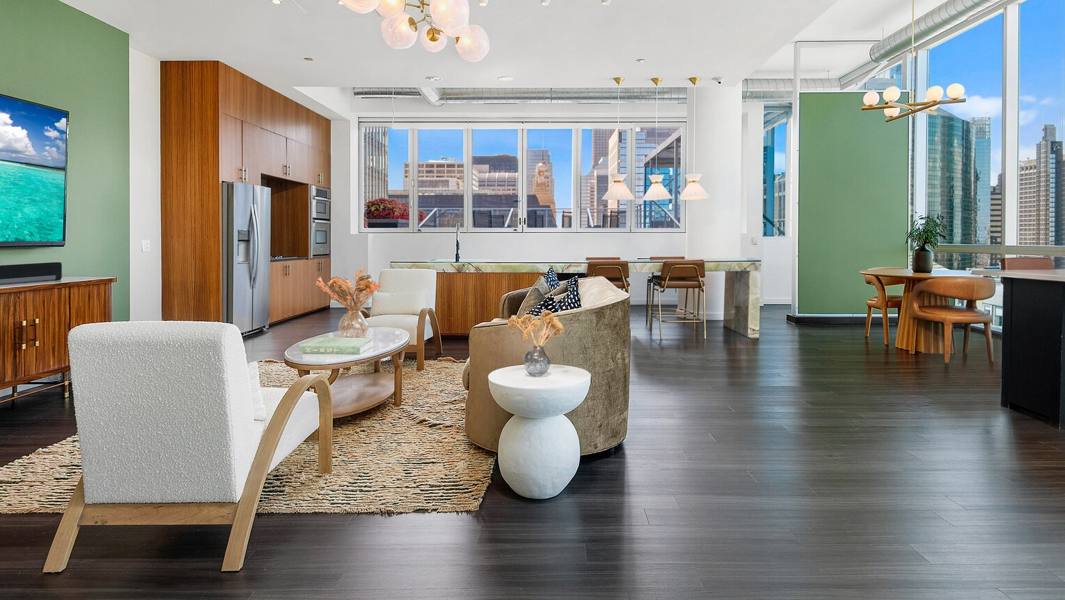 Env Chicago spacious living area with an open-plan kitchen, modern decor, and large windows with city views