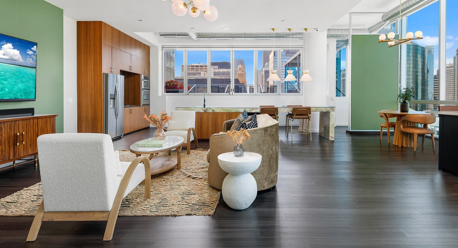 Env Chicago spacious living area with an open-plan kitchen, modern decor, and large windows with city views