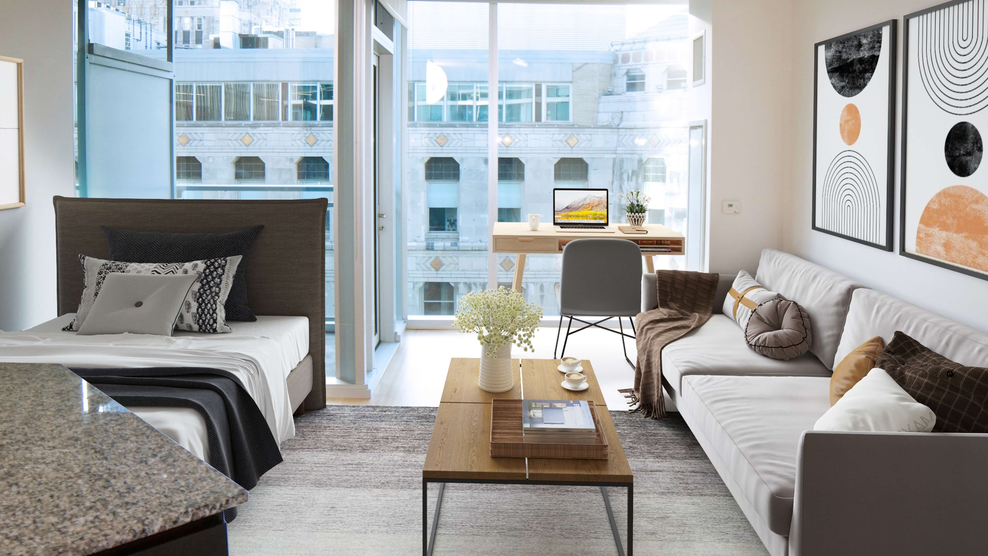 Env Chicago studio apartment with a dedicated desk area, bed, and living space, offering city views