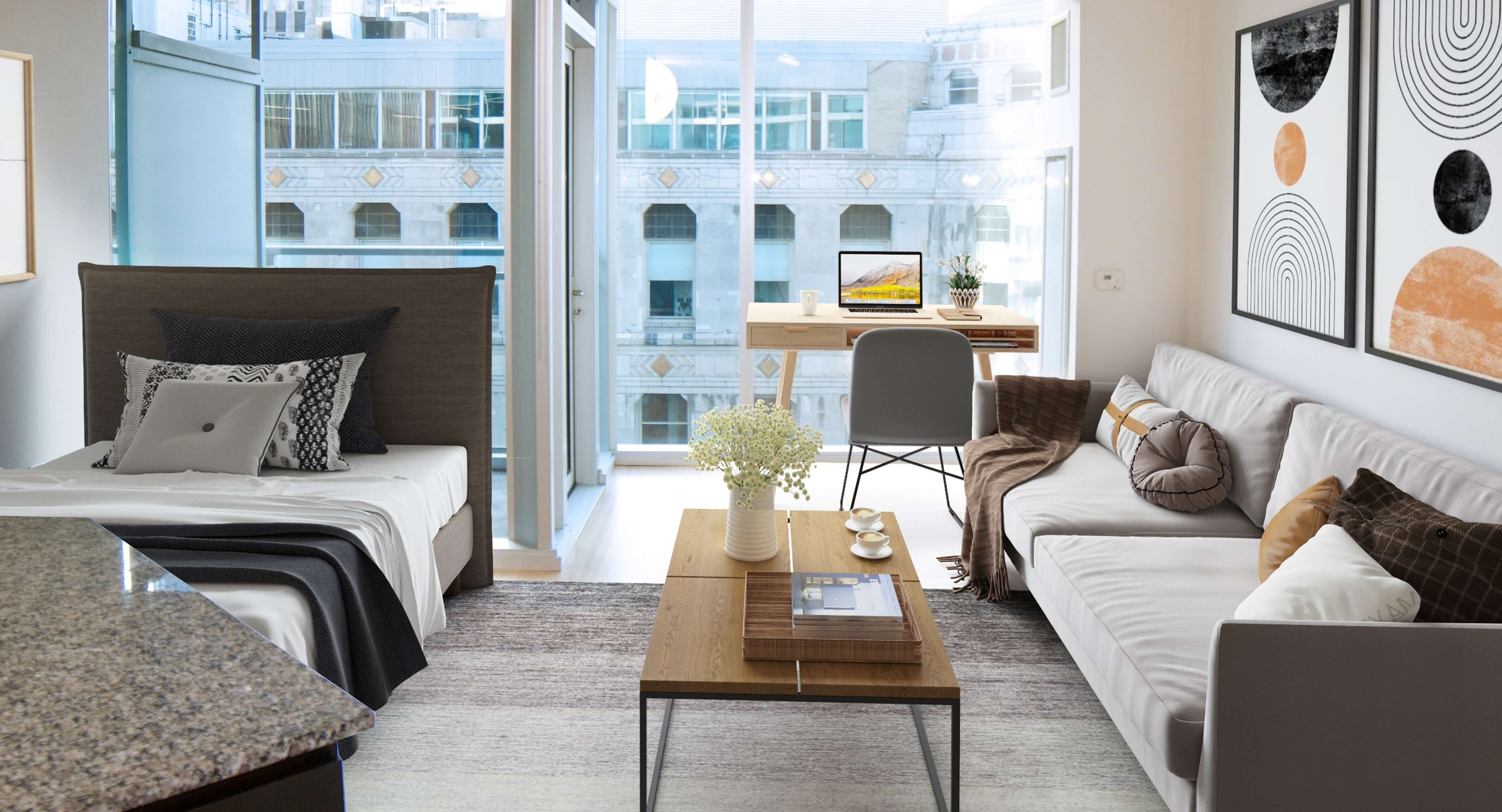 Env Chicago studio apartment with a dedicated desk area, bed, and living space, offering city views