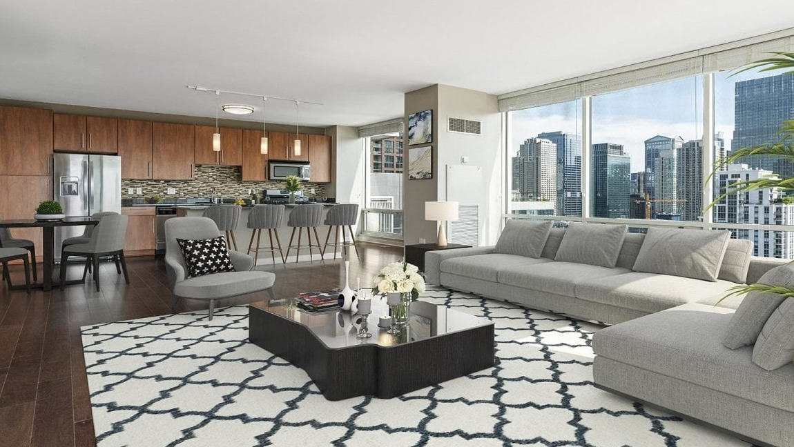 Spacious open-concept apartment at Flair Tower Apartments in Chicago, featuring a modern living room, dining area, and kitchen with city views
