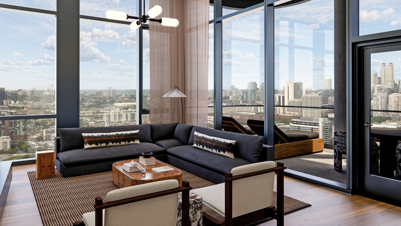 Chic apartment living room at Flora in Chicago, with a large sectional sofa, modern fireplace, and a balcony offering expansive city views