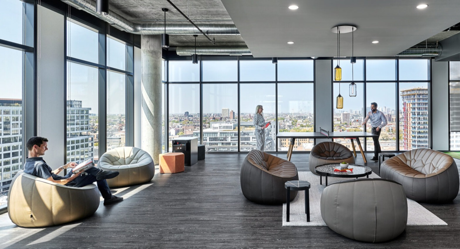 Modern co-working lounge at Fulbrix Apartments in Chicago, offering comfortable seating, city views, and a relaxed atmosphere for productivity