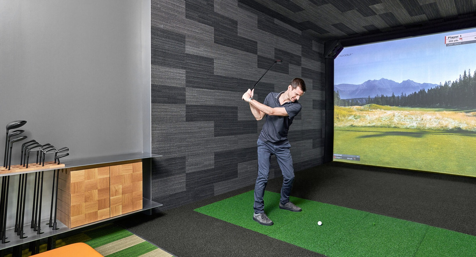 State-of-the-art golf simulator at Fulbrix Apartments in Chicago, offering a realistic virtual golfing experience for residents