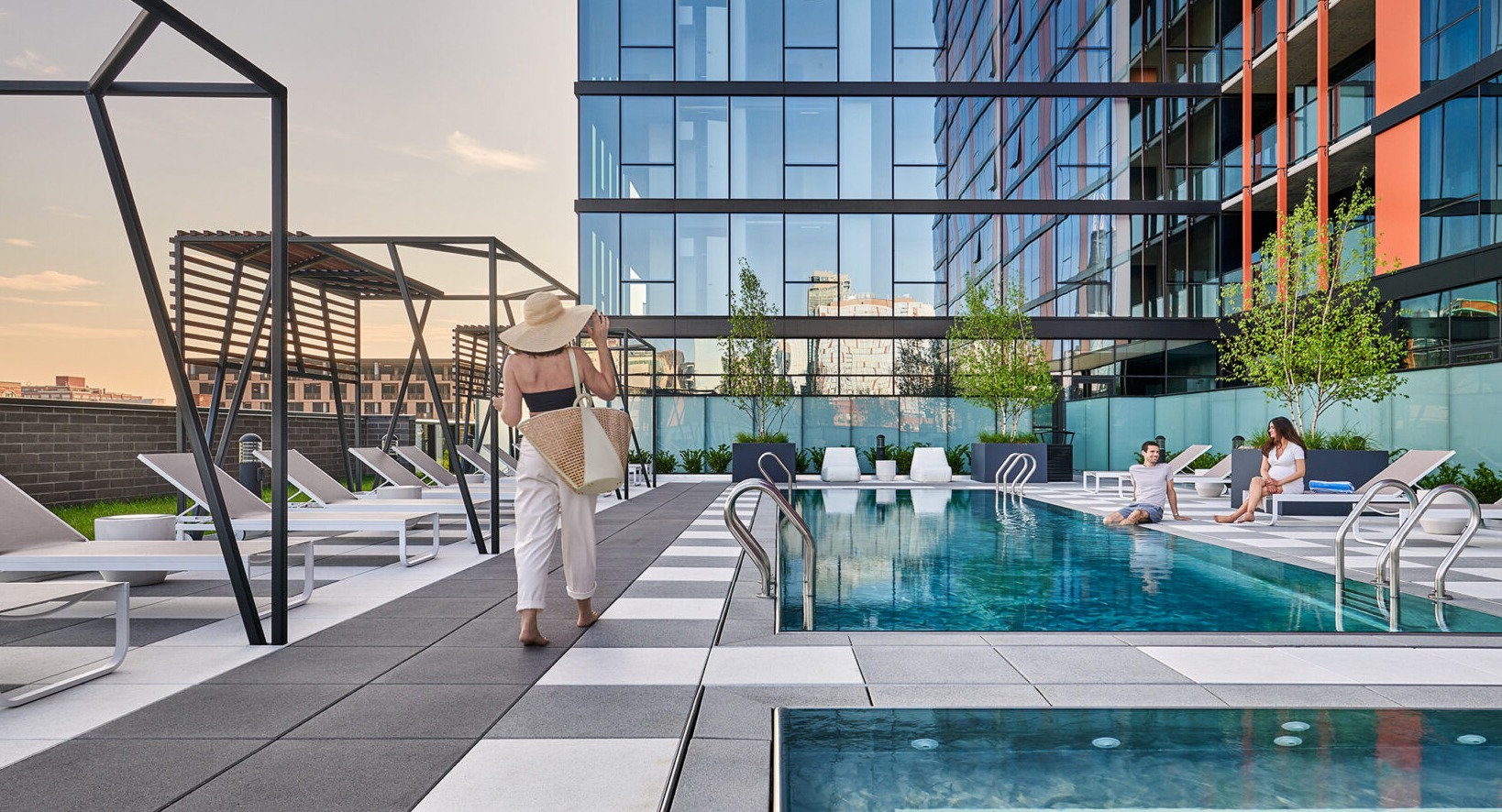 Inviting pool deck at Fulbrix Apartments in Chicago, with residents relaxing by the water, offering a serene escape