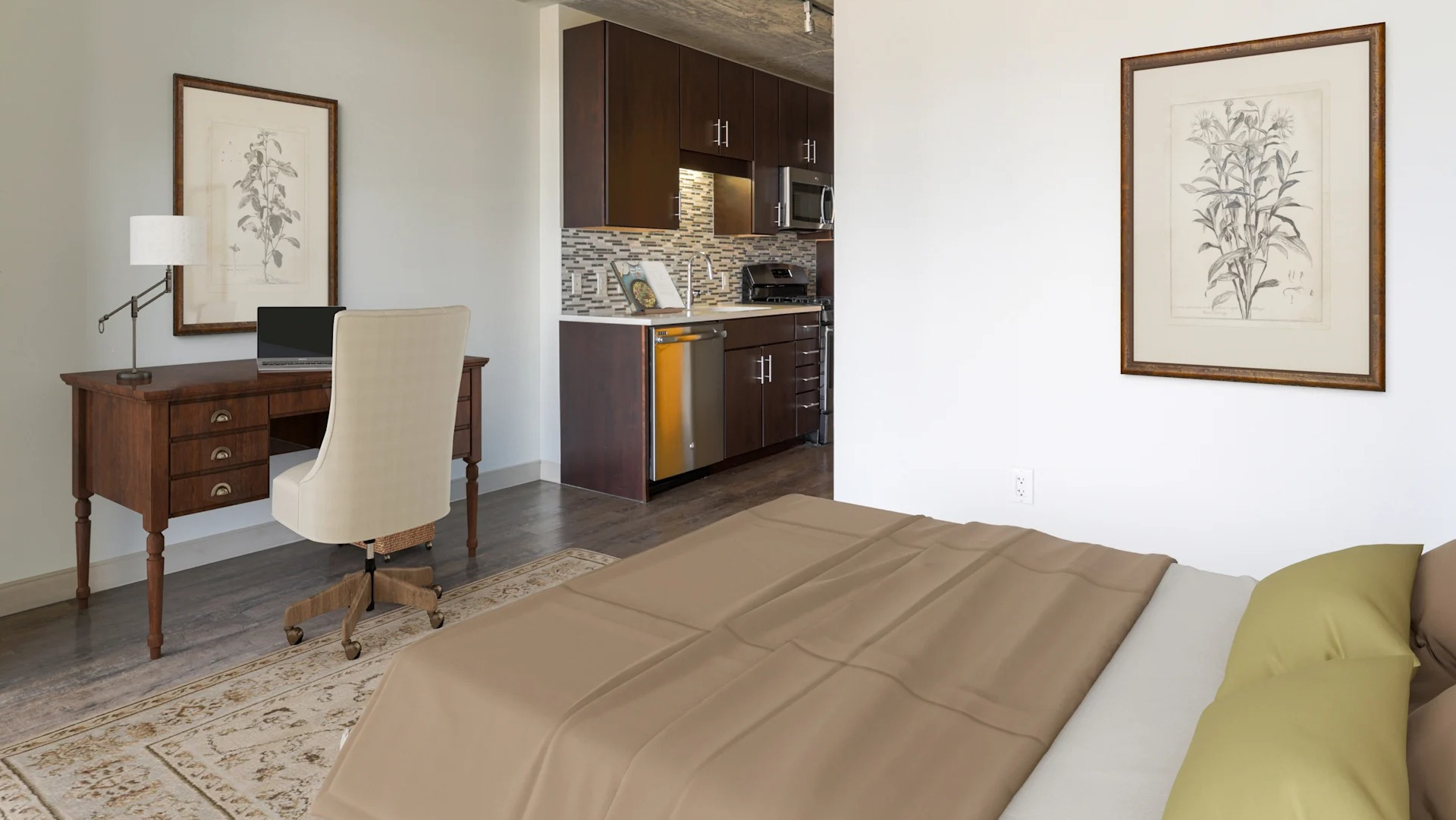 Cozy bedroom with a dedicated work-from-home office space and modern kitchen in the background at Gateway West Loop, Chicago