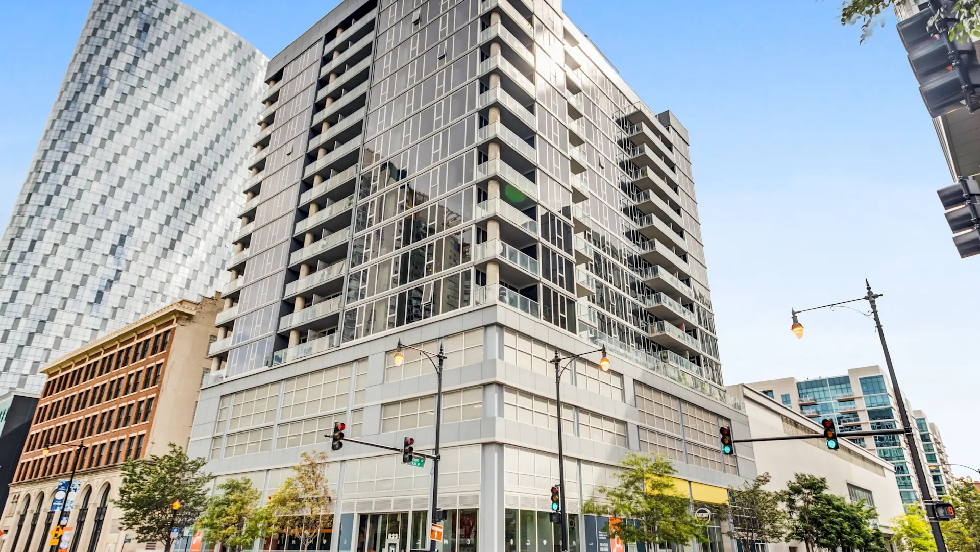 Exterior street view of the modern Gateway West Loop apartment building, showcasing its contemporary architecture in Chicago