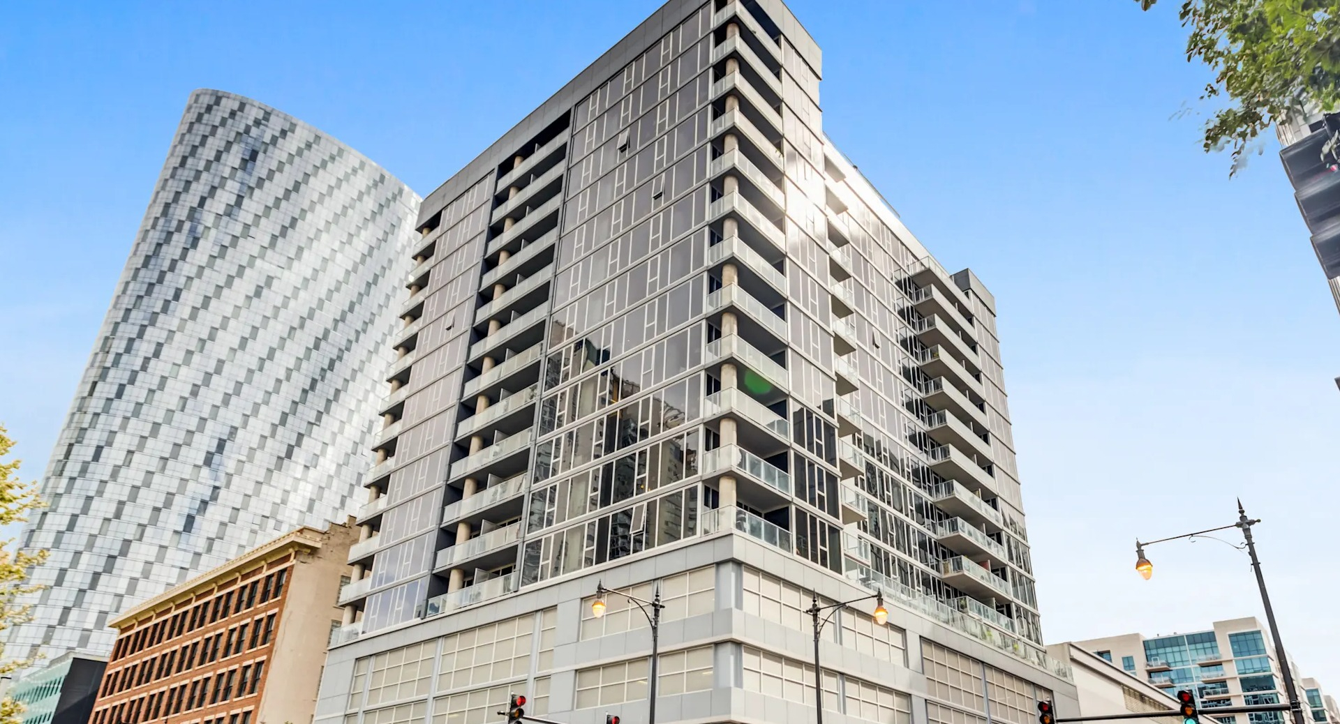 Exterior street view of the modern Gateway West Loop apartment building, showcasing its contemporary architecture in Chicago