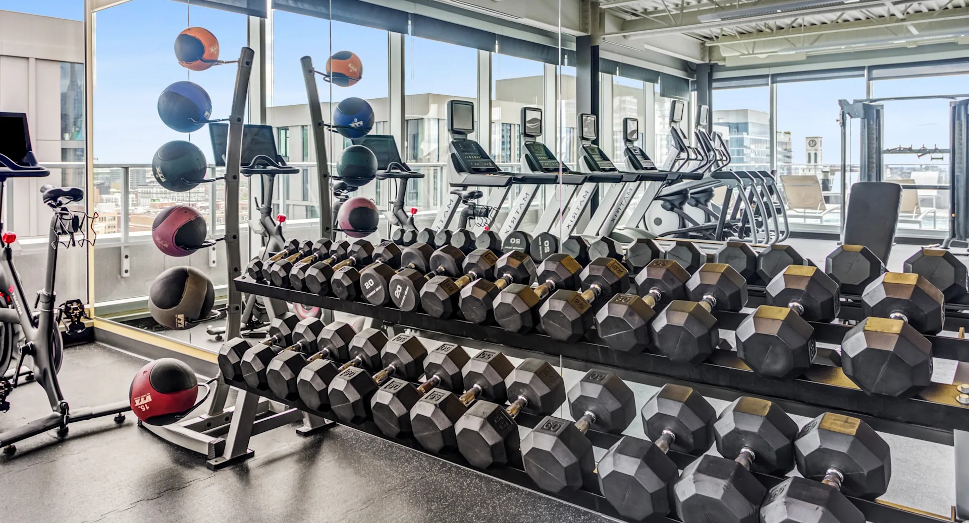 Well-equipped fitness center with a wide selection of free weights and exercise equipment at Gateway West Loop, Chicago