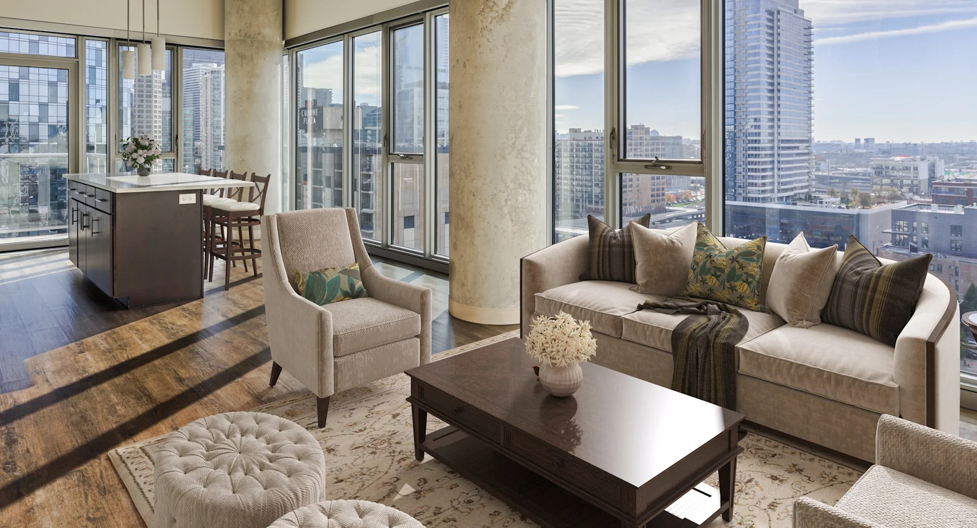 Spacious living room with comfortable seating, modern furnishings, and panoramic city views at Gateway West Loop, Chicago
