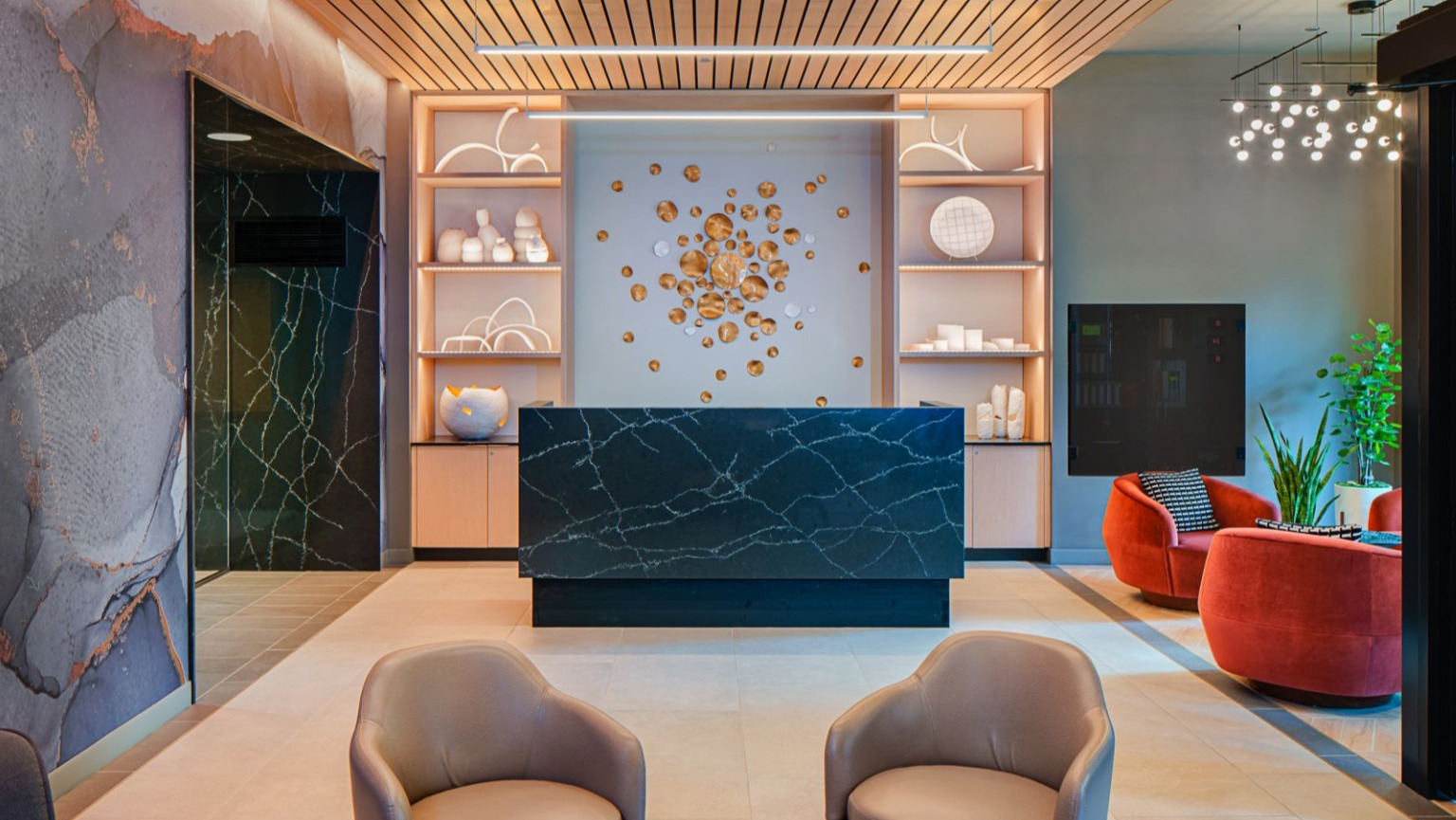 Modern and welcoming lobby lounge area with stylish seating and contemporary design elements at Gild apartments in Chicago