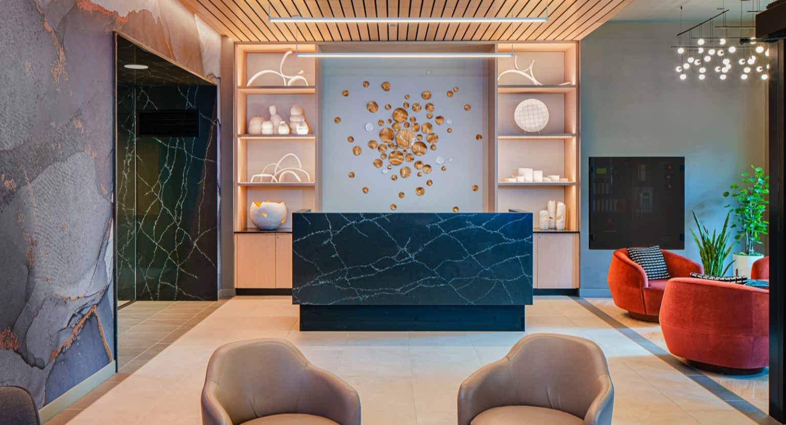 Modern and welcoming lobby lounge area with stylish seating and contemporary design elements at Gild apartments in Chicago