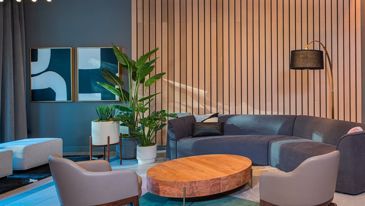 Elegant lounge area with comfortable seating, modern decor, and a warm ambiance at Gild apartments in Chicago