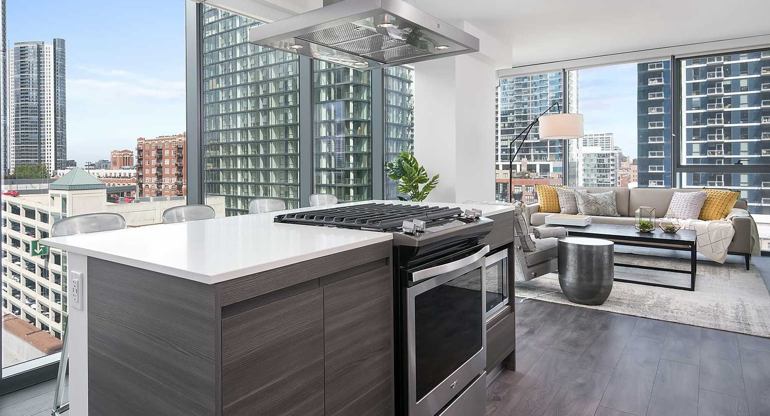 A gourmet kitchen at Hubbard 221 with a large island, stainless steel appliances, and an open layout to the living area