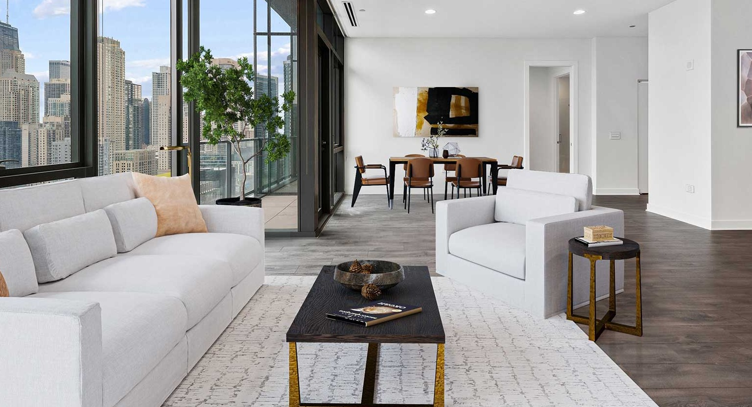 An expansive living and dining area at Hubbard 221 with modern white furniture and stunning skyline views from the balcony