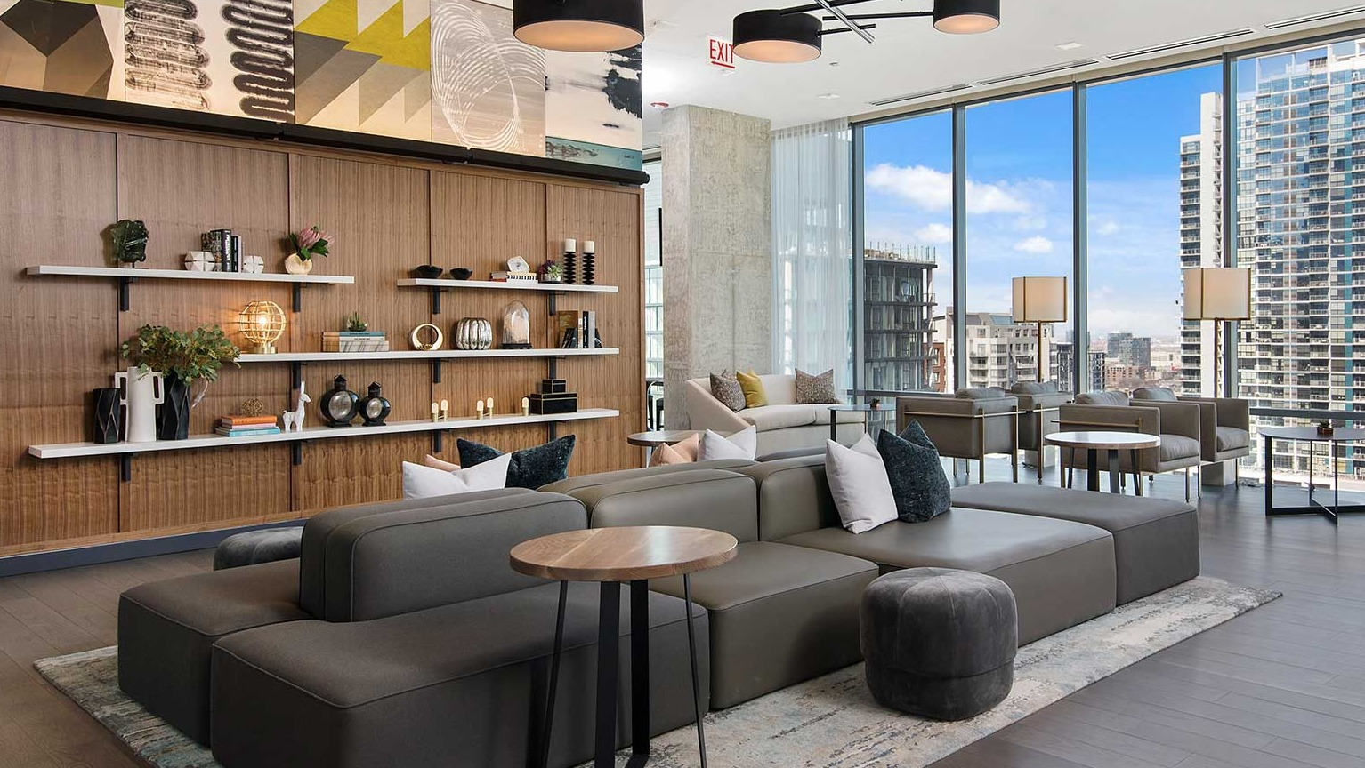 A spacious and contemporary lobby lounge at Hubbard 221 with various seating arrangements and tasteful decor