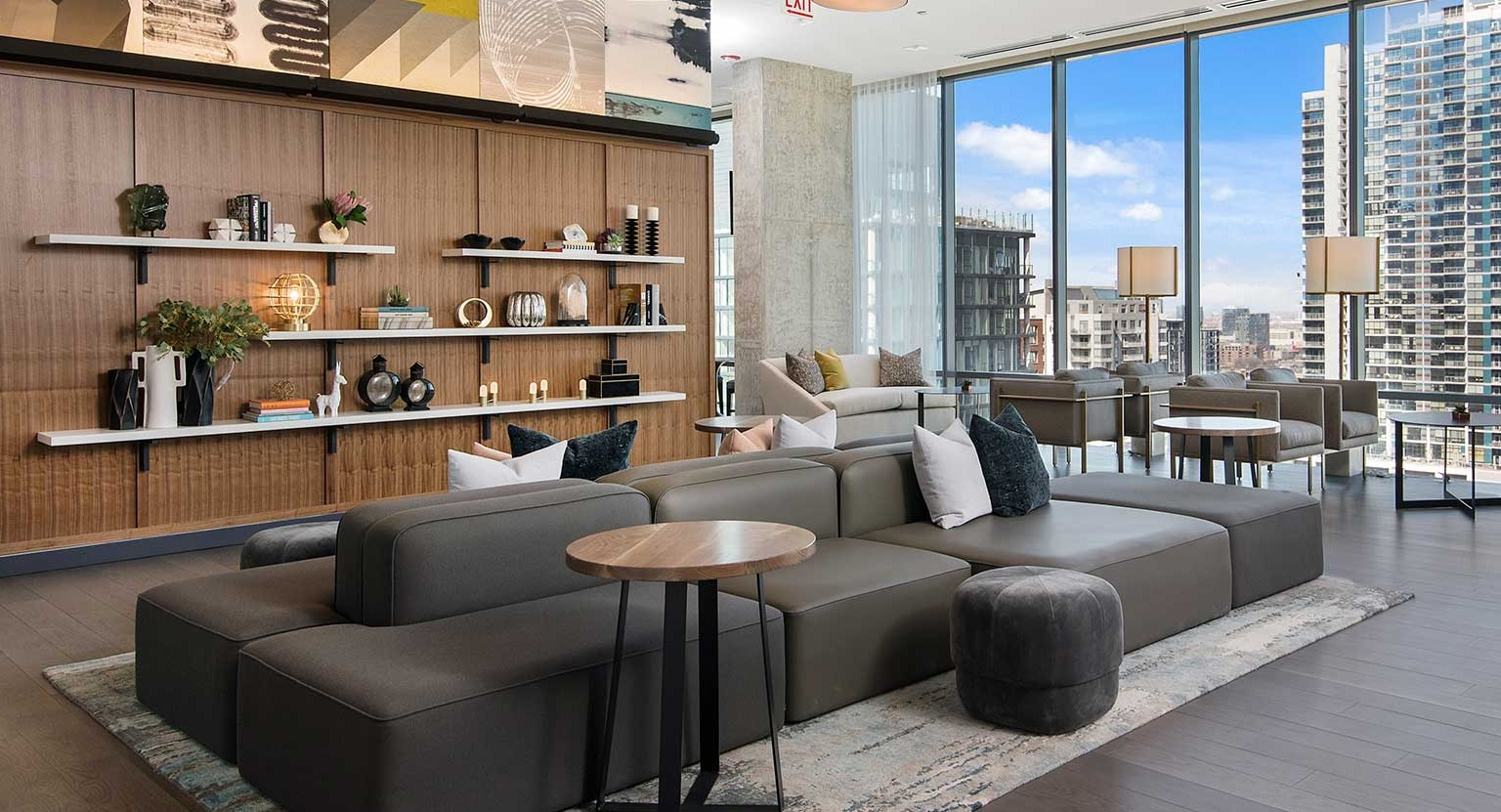 A spacious and contemporary lobby lounge at Hubbard 221 with various seating arrangements and tasteful decor