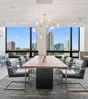 Modern conference room with a spacious table and high-tech equipment at Hubbard Place in Chicago