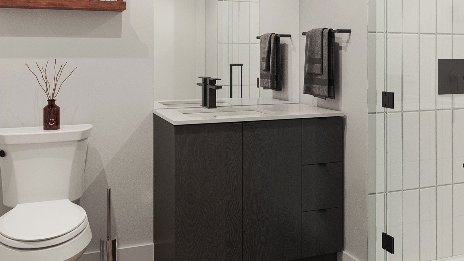 Contemporary bathroom with a modern vanity, toilet, and a sleek walk-in shower with black fixtures at Hugo Apartments River North, Chicago