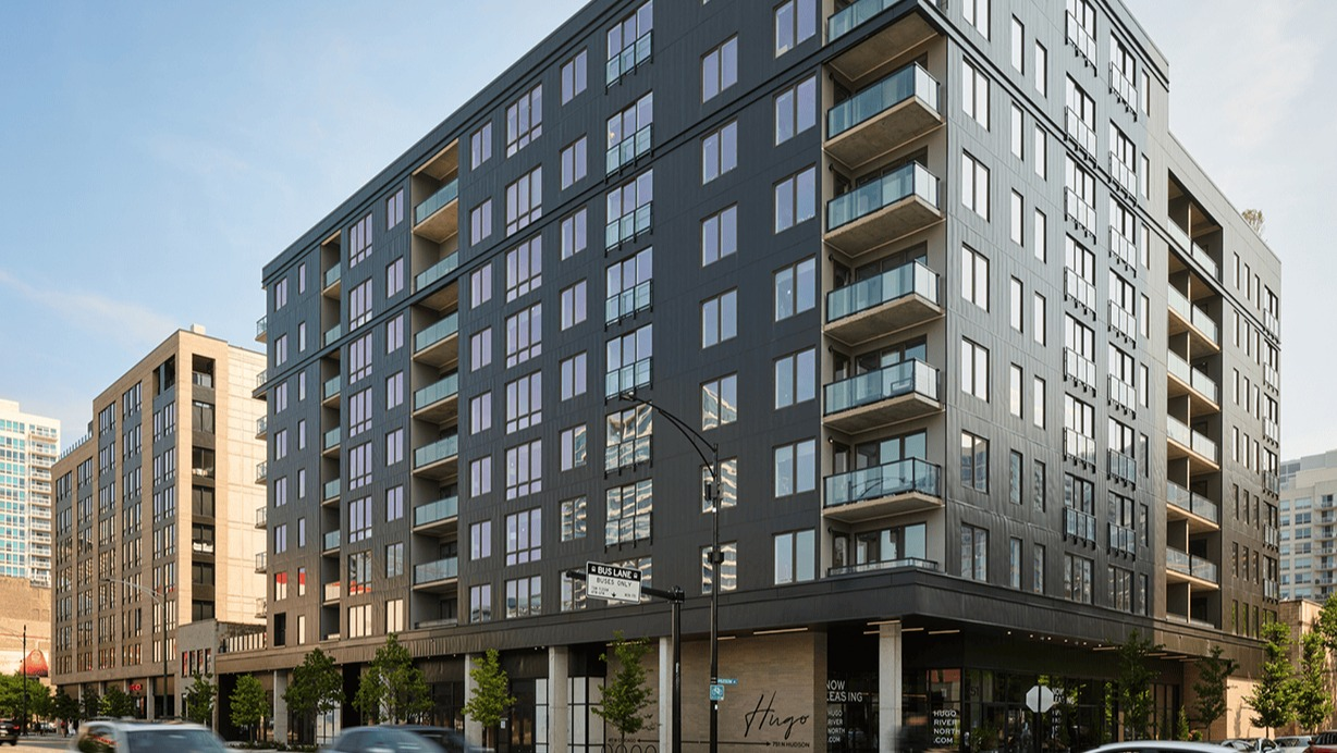 Modern building exterior of Hugo Apartments River North, showcasing its contemporary architecture and street view in Chicago