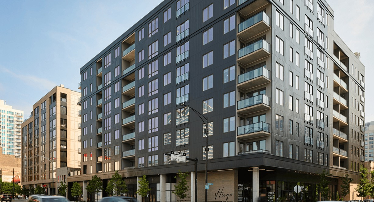 Modern building exterior of Hugo Apartments River North, showcasing its contemporary architecture and street view in Chicago