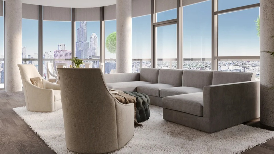 Luxurious resident lounge with a large sectional sofa, accent chairs, and panoramic city skyline views at Imprint apartments in Chicago