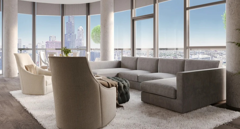 Luxurious resident lounge with a large sectional sofa, accent chairs, and panoramic city skyline views at Imprint apartments in Chicago
