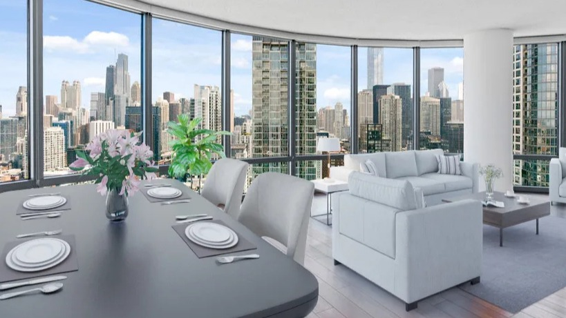 Elegant dining and living room with a formal dining table, comfortable sofas, and floor-to-ceiling windows providing city views at Kingsbury Plaza in Chicago