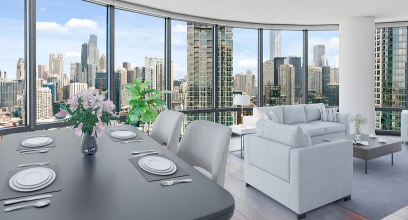 Elegant dining and living room with a formal dining table, comfortable sofas, and floor-to-ceiling windows providing city views at Kingsbury Plaza in Chicago