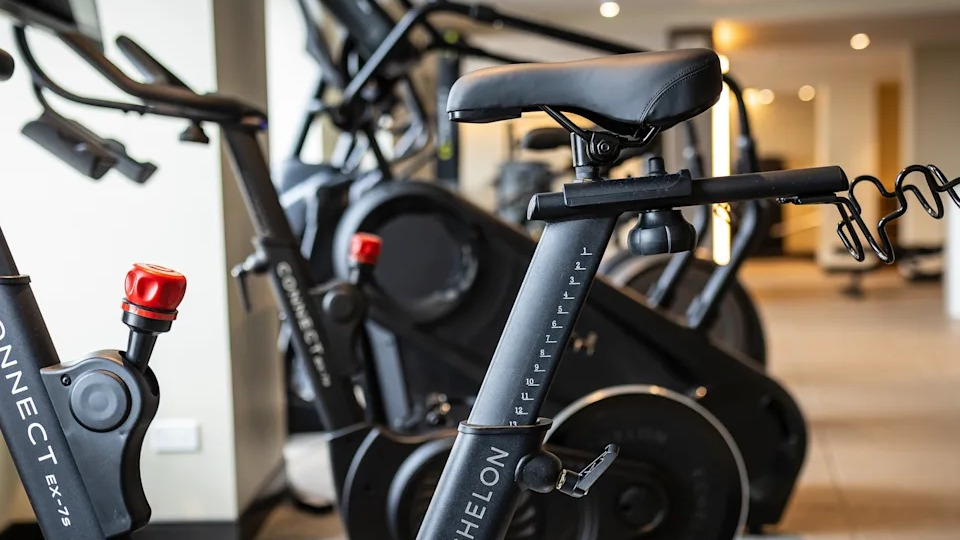 Kingsbury Plaza fitness center with close-up of modern spin bikes, offering residents a convenient workout option