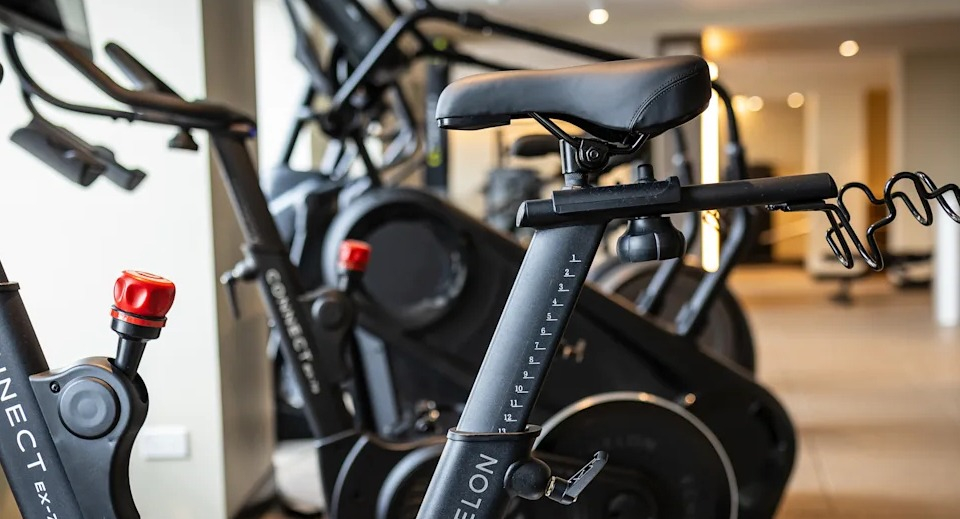 Kingsbury Plaza fitness center with close-up of modern spin bikes, offering residents a convenient workout option