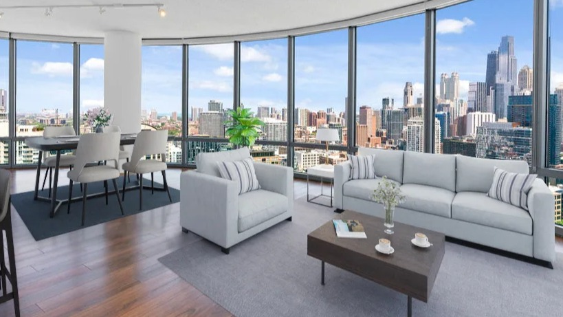 Spacious living and dining area with a curved wall of windows offering panoramic city views, modern furniture at Kingsbury Plaza in Chicago