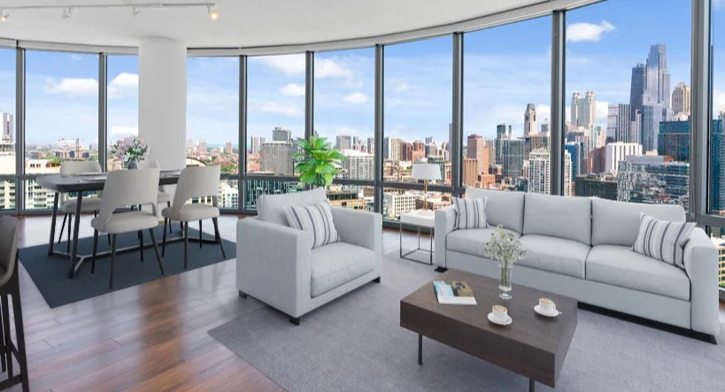 Spacious living and dining area with a curved wall of windows offering panoramic city views, modern furniture at Kingsbury Plaza in Chicago