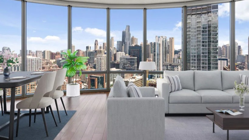 Bright living and dining area with comfortable seating, a dining table, and stunning views of the Chicago skyline at Kingsbury Plaza