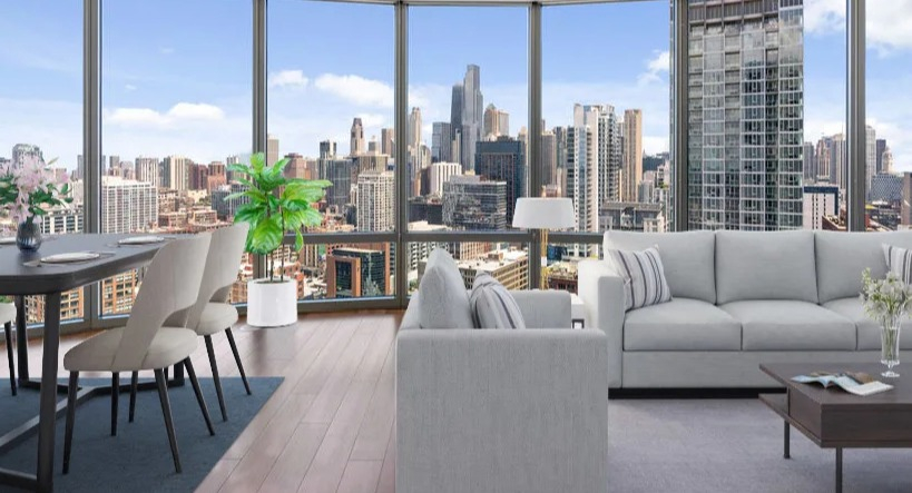 Bright living and dining area with comfortable seating, a dining table, and stunning views of the Chicago skyline at Kingsbury Plaza