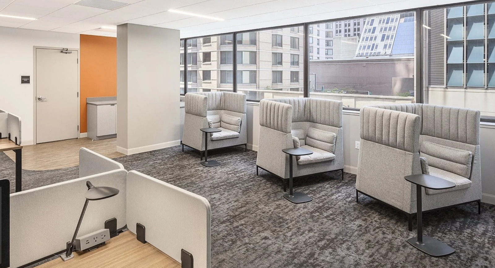 Productive co-working space featuring individual pods and shared desk areas, perfect for residents at Lake Shore Plaza Chicago
