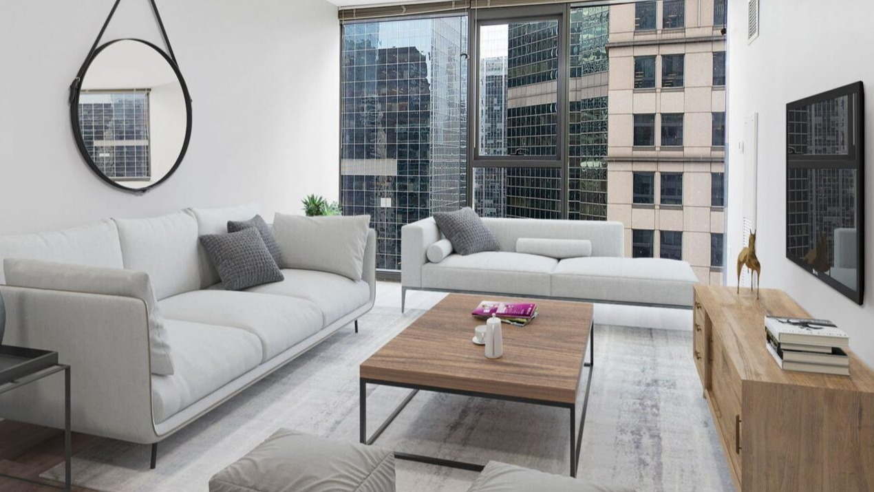 Bright living room at Lake & Wells with comfortable white sofas, modern decor, and expansive city views