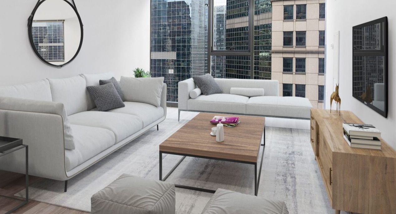 Bright living room at Lake & Wells with comfortable white sofas, modern decor, and expansive city views