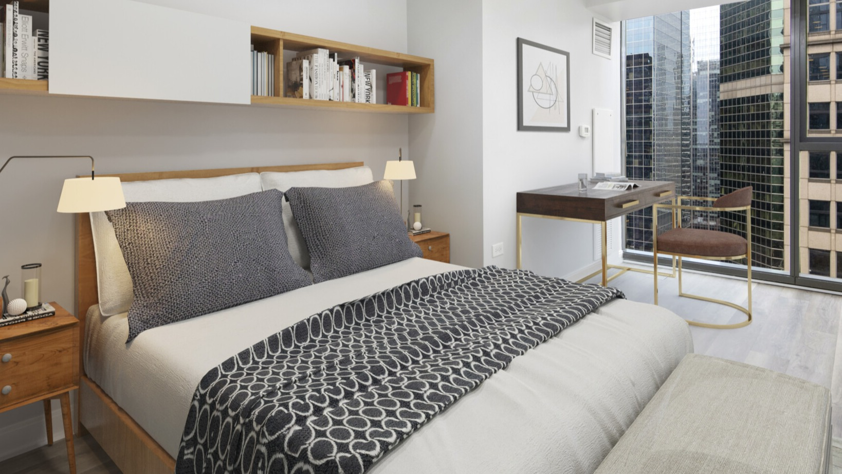 Lake & Wells cozy bedroom featuring a comfortable bed, built-in shelving, and a dedicated desk space with city views