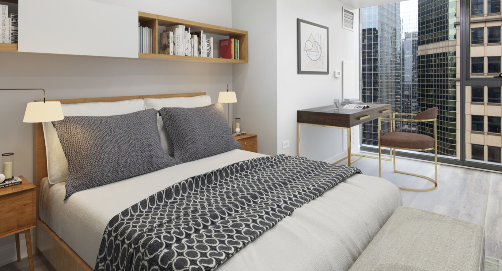 Lake & Wells cozy bedroom featuring a comfortable bed, built-in shelving, and a dedicated desk space with city views