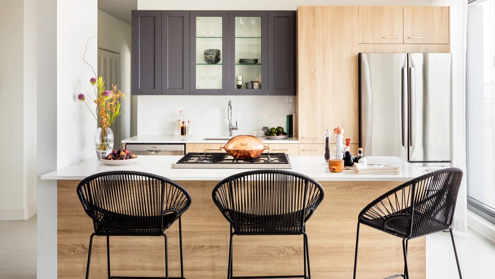 Contemporary apartment kitchen at Landmark West Loop in Chicago, with a large island and bar seating, perfect for casual dining and entertaining