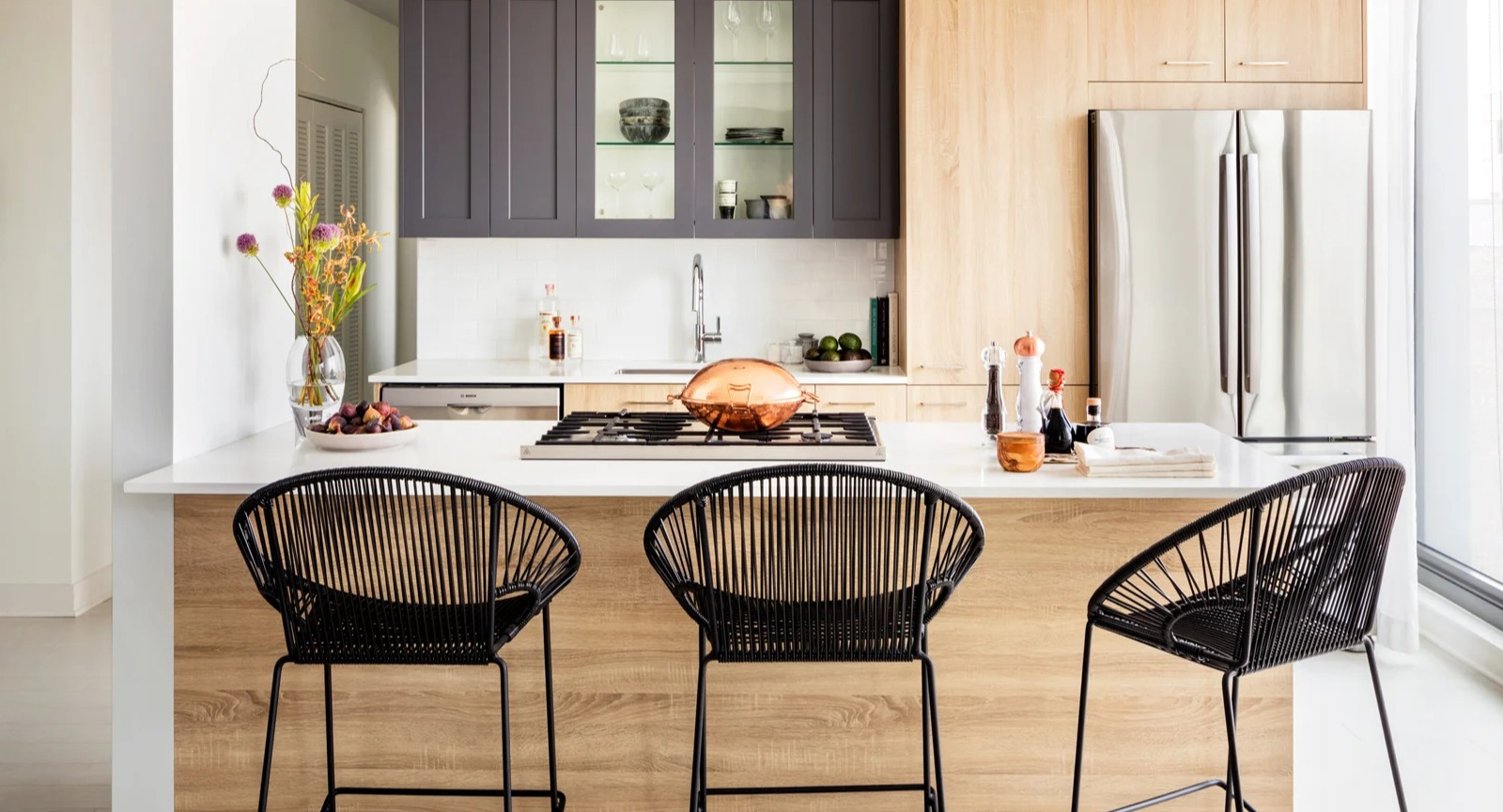 Contemporary apartment kitchen at Landmark West Loop in Chicago, with a large island and bar seating, perfect for casual dining and entertaining