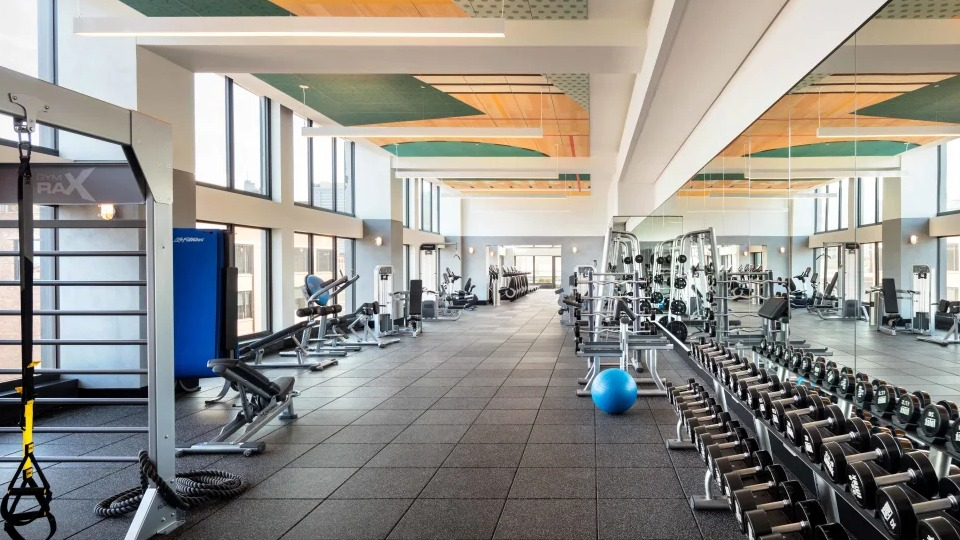 Expansive, modern fitness center with a wide selection of strength and cardio equipment at Landmark West Loop apartments in Chicago