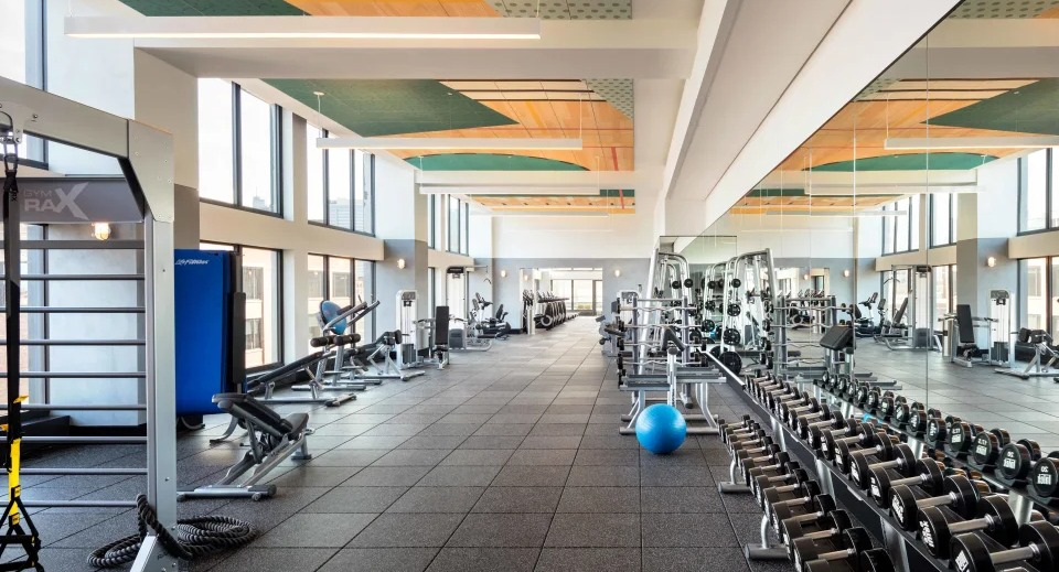 Expansive, modern fitness center with a wide selection of strength and cardio equipment at Landmark West Loop apartments in Chicago