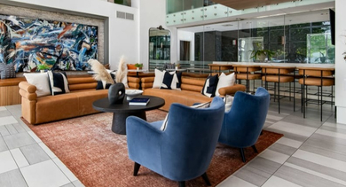 Chic and modern lobby lounge area with stylish furniture and contemporary design, perfect for greeting guests at Left Bank in Chicago